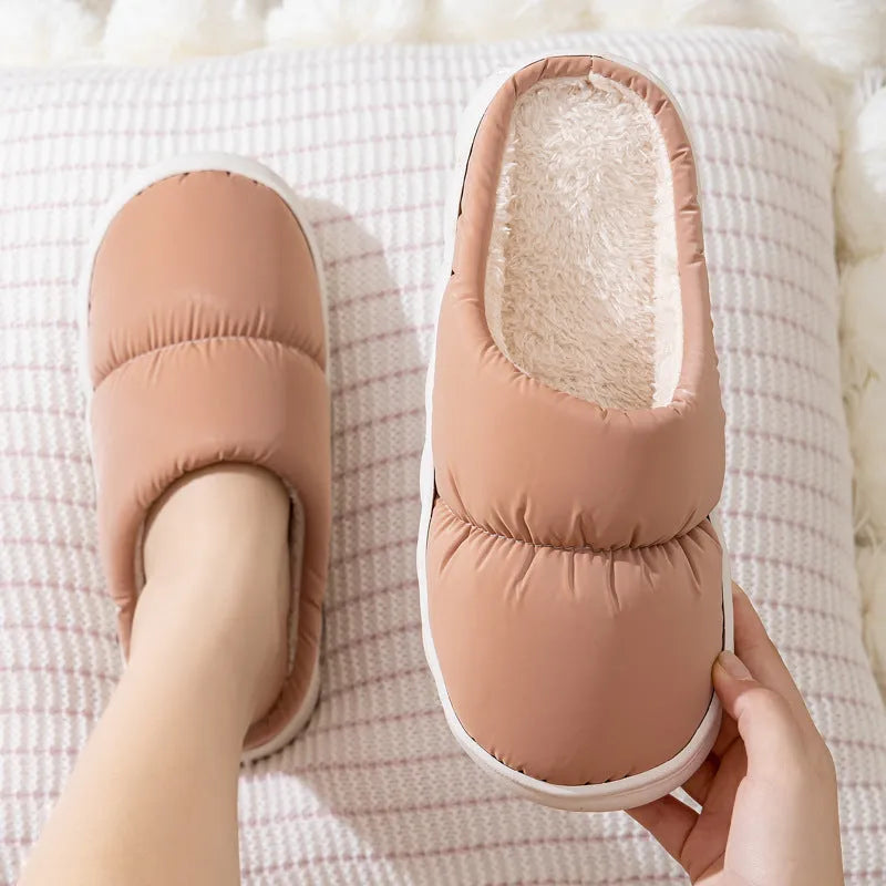Blue winter slippers with artificial leather upper and thick rubber sole, showing plush lining.