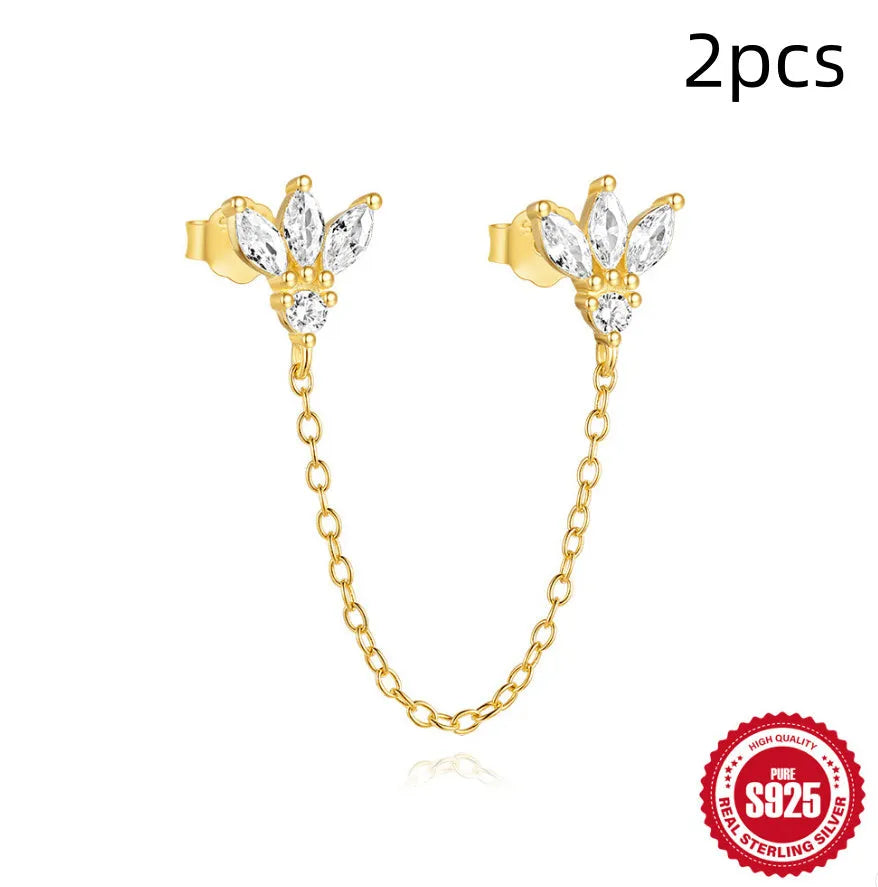 Close-up of a golden double ear piercings chain design stud earring made from S925 sterling silver with inlaid zircon stone.