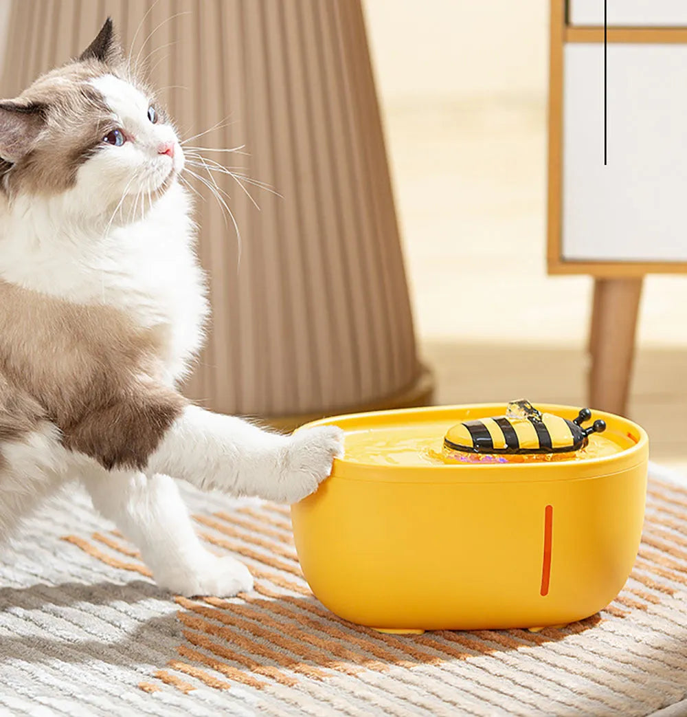 Yellow cat water fountain with filtration system and USB power cable