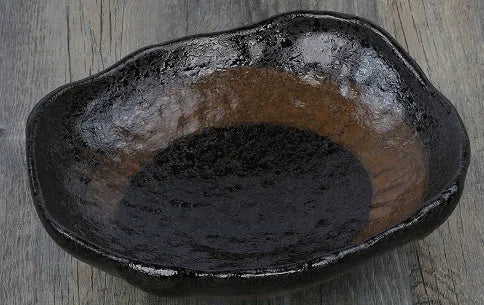 Creative Japanese style irregular shaped porcelain sashimi bowl with floral decoration and a small sauce dish