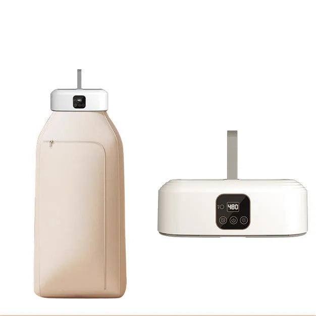 White cylindrical foldable laundry drier with remote control on flat surface