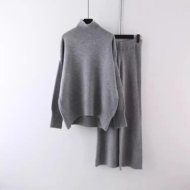 Women's casual two-piece set featuring a long sleeve sweater and wide leg trousers in a solid colour.