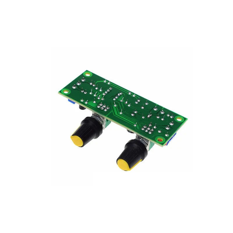 Front stage bass boost circuit board with components mounted on FR-4 fibreglass showing mounting holes and connections