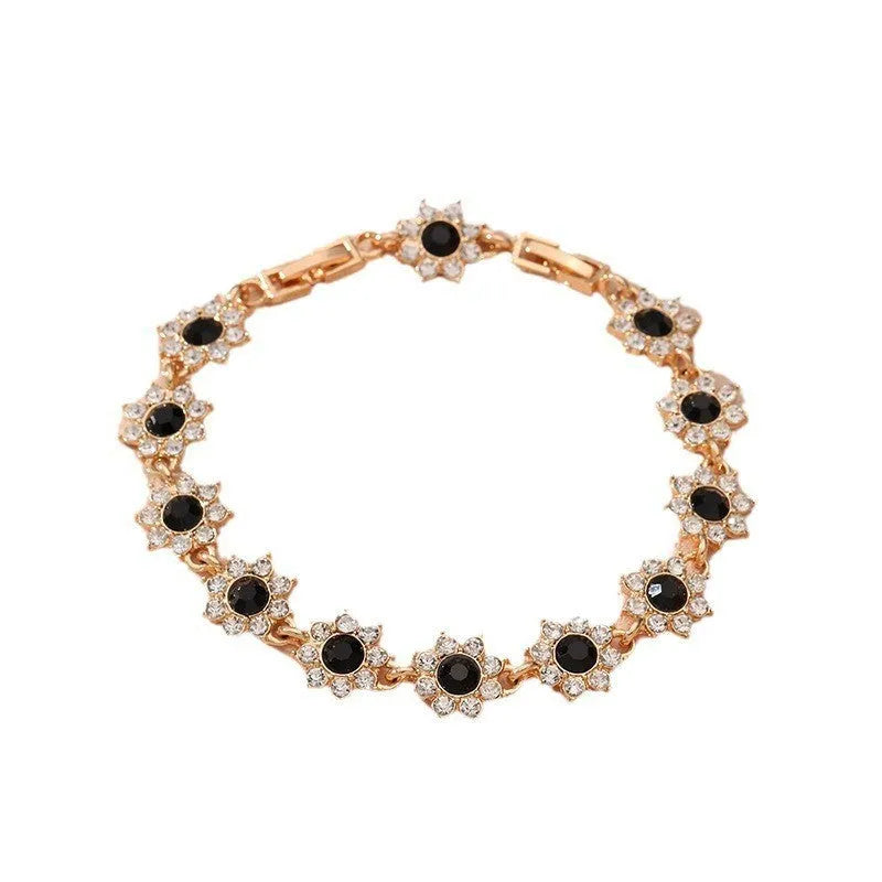 Gold and silver electroplated flower bracelet with coloured gemstone accents on zinc alloy
