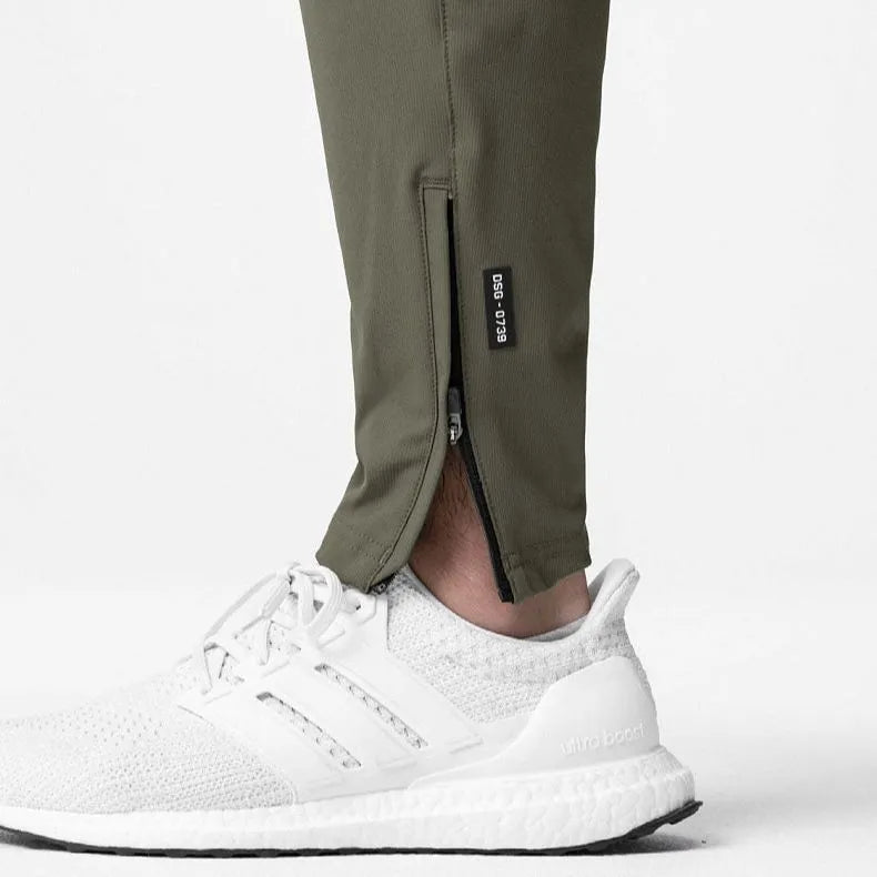 Men's loose grey quick-dry fitness trousers with ankle-tied cuffs for running and gym workouts