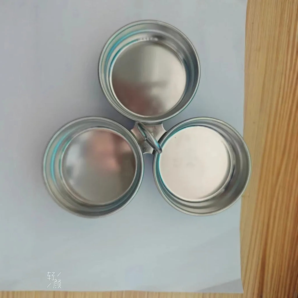 Mini stainless steel egg steamer in heart-shaped design with compact kitchen appliance dimensions