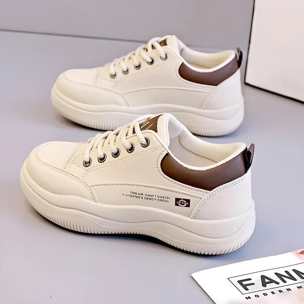 Women's white Korean-style lace-up shoes with cross straps and a mid heel on a rubber sole.
