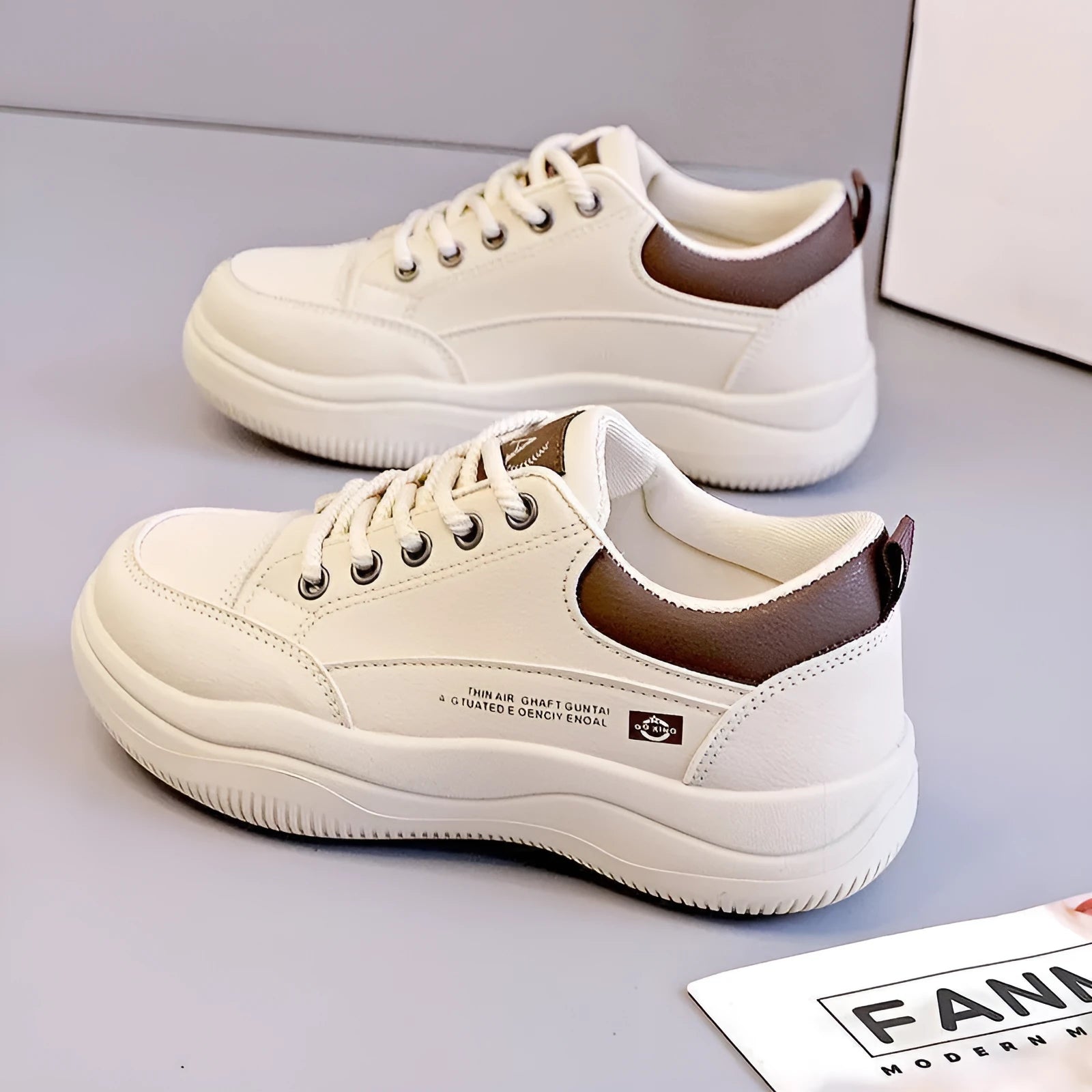 Women's white Korean-style lace-up shoes with cross straps and a mid heel on a rubber sole.
