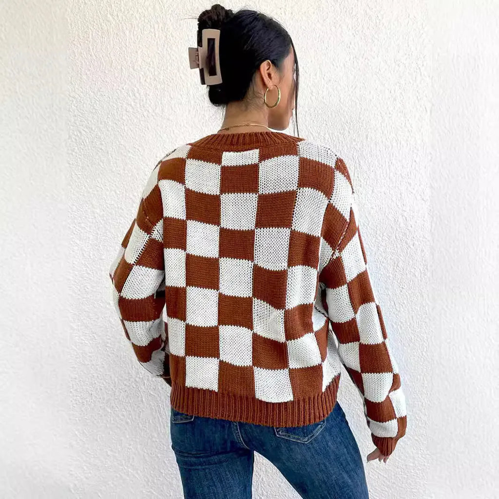 Dark brown plaid acrylic pullover sweater with round neck and long sleeves on hanger