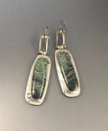 Geometric alloy earrings with black and white marble pattern showing front and side views