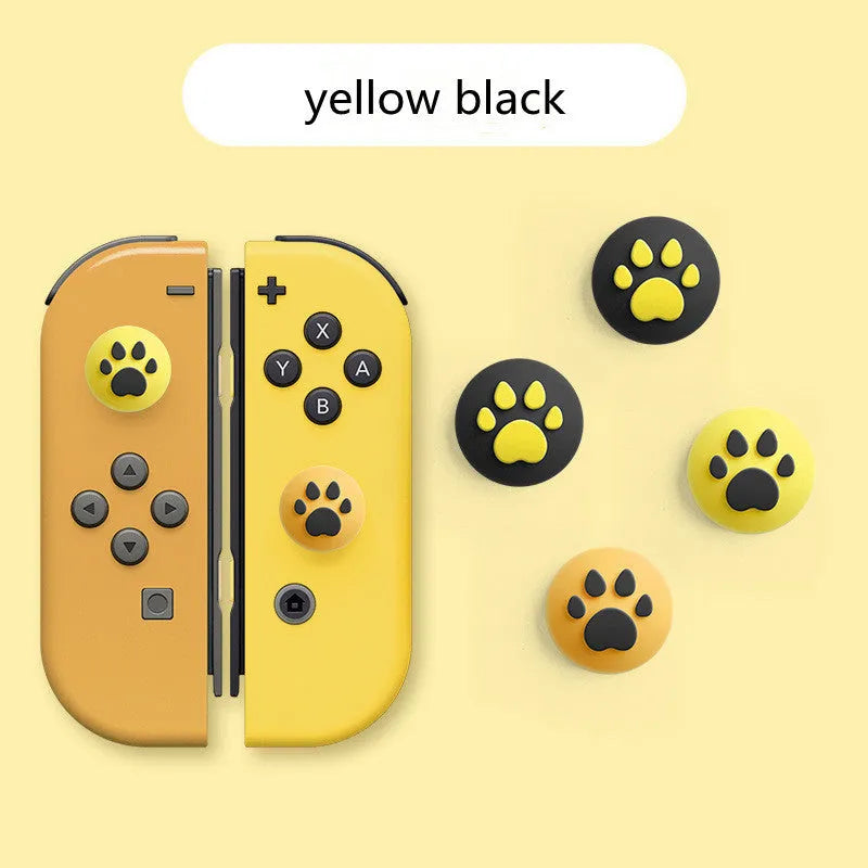 Four silicone rocker caps for Nintendo Switch Joy-Con controllers in assorted colours on a grey background.