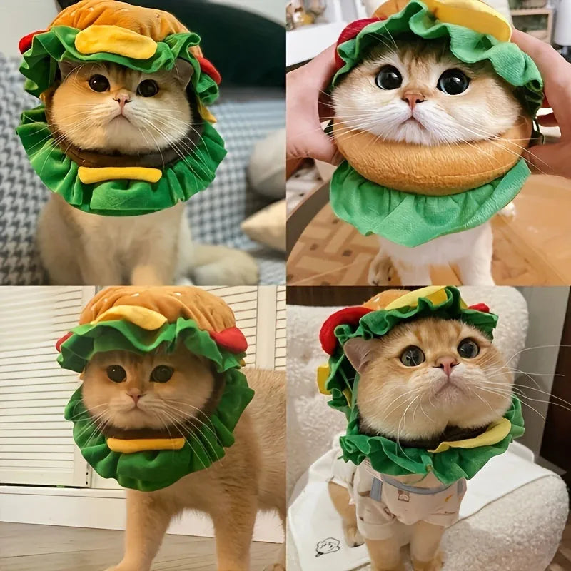 Cartoon-style burger headdress hat for cats, shown in soft fabric with adjustable strap.