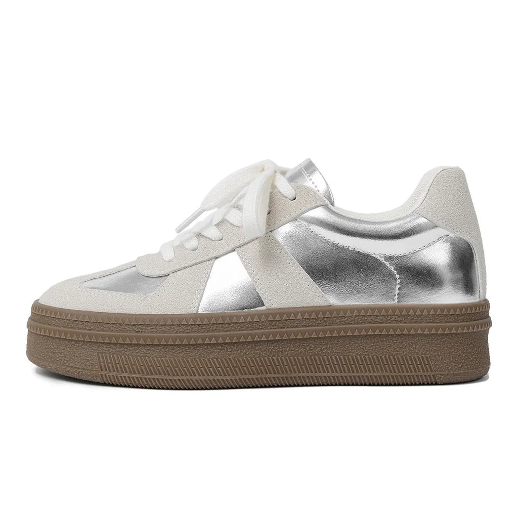 Retro sports shoes with round toe, cross straps, and lace-up front in milky white colour