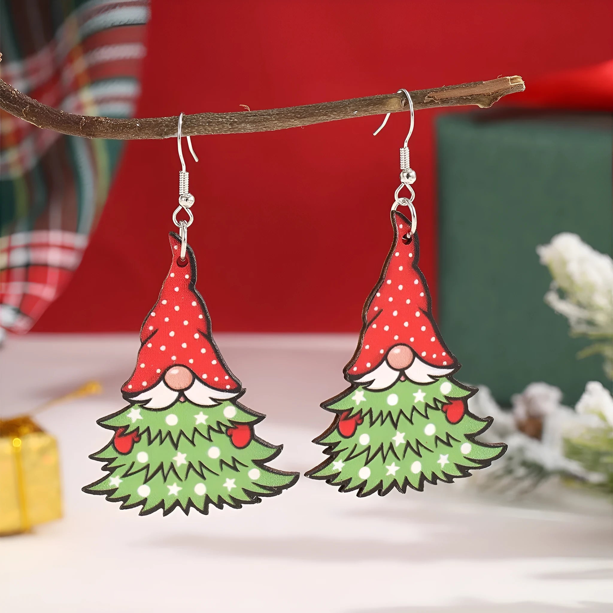 Wooden Christmas earrings with printed tree and snowman designs in geometric shapes