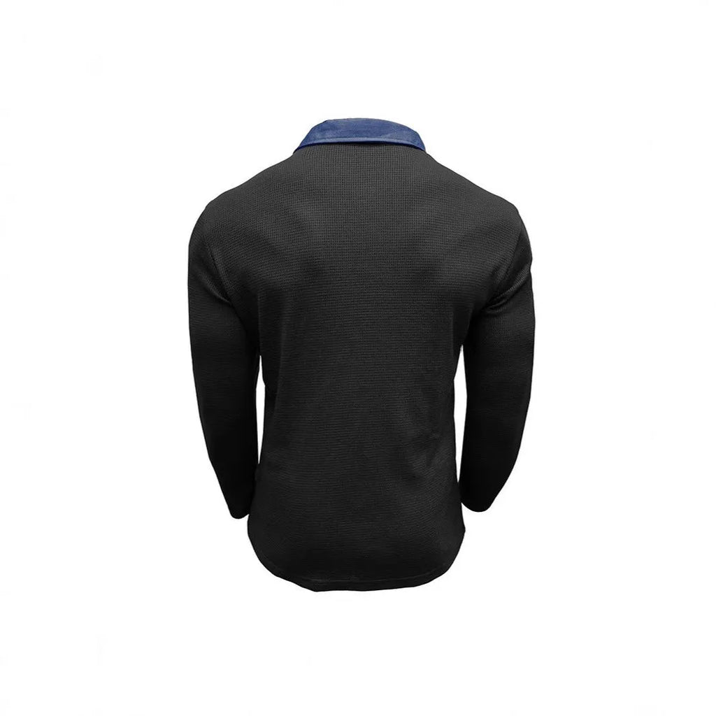 Man wearing a long-sleeve waffle-texture polo shirt in a loose retro fit, showing asymmetric design detail.