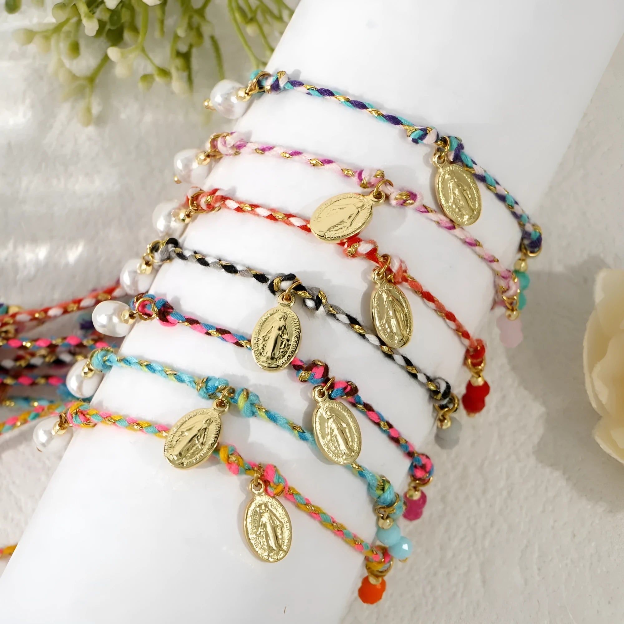 Hand-woven colourful braided rope bracelet with adjustable knot and decorative strap tag