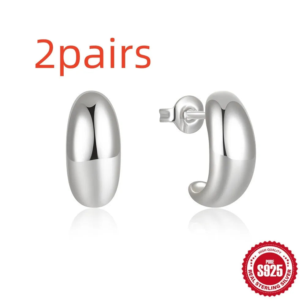 Sterling silver C-shaped geometric ring stud earrings in gold or silver tone.