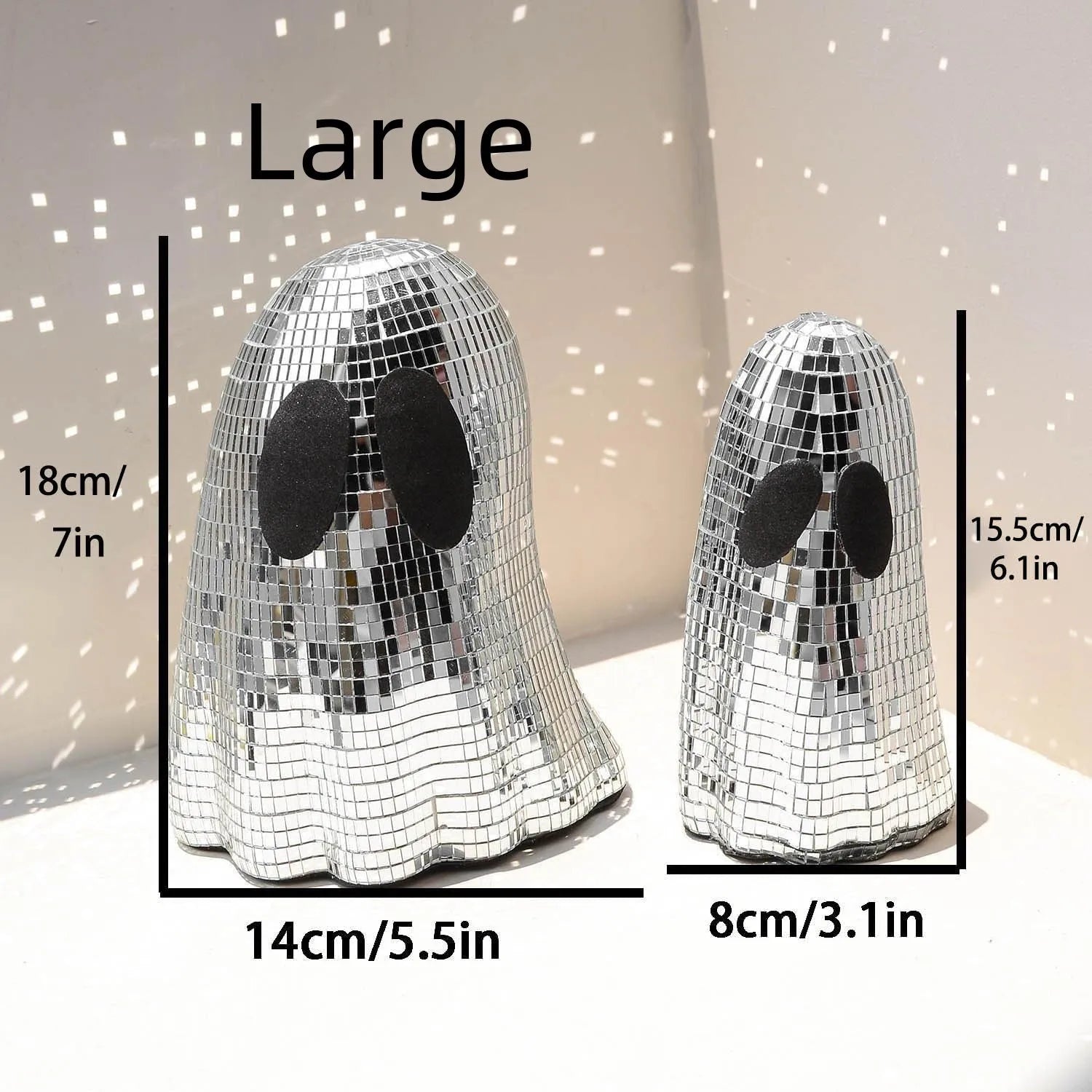 Silver Halloween ghost decoration with glass mosaic mirror patch design on dark surface