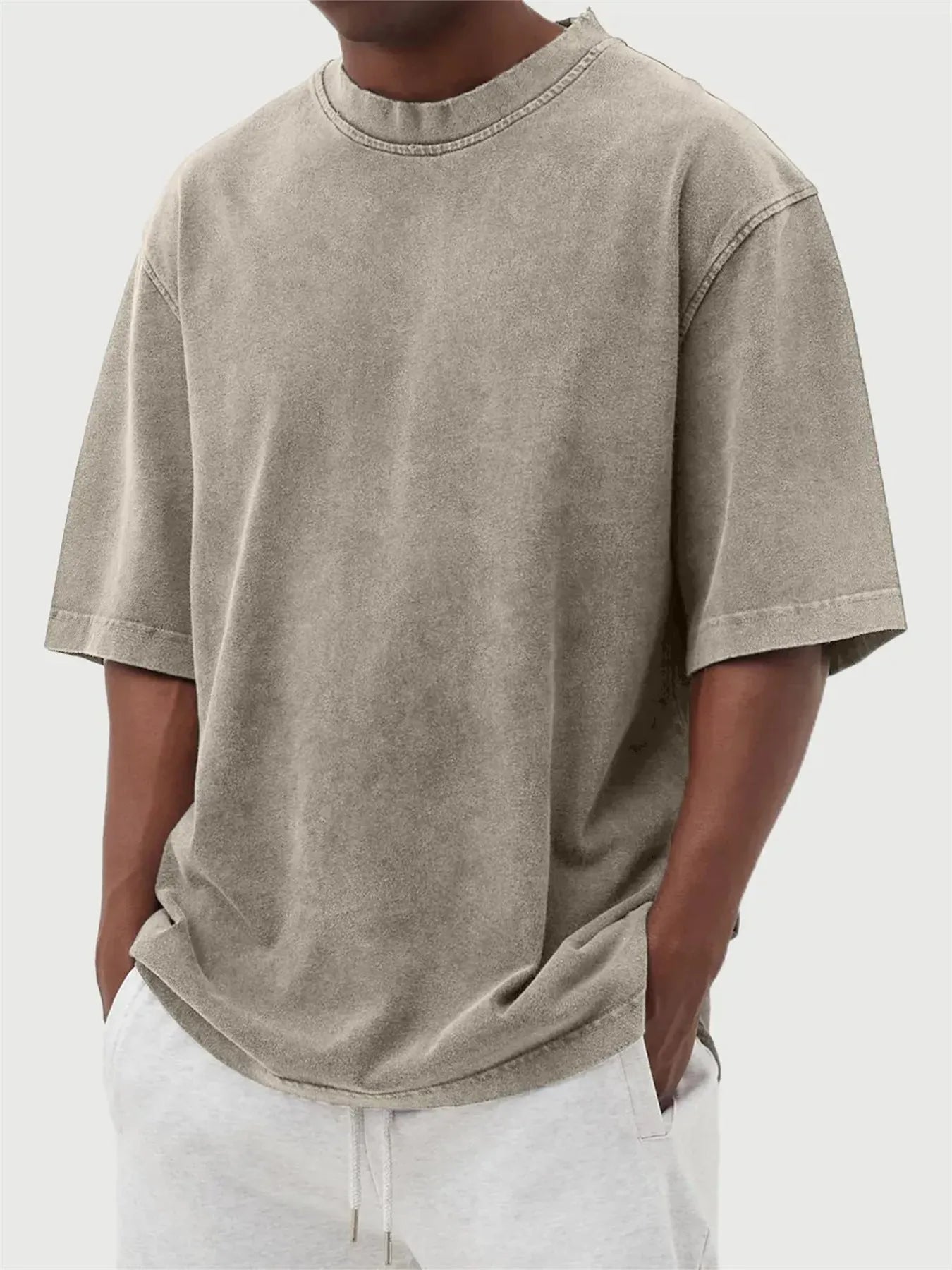 Men's distressed stone wash pullover T-shirt in loose fit with half sleeves available in multiple solid colours