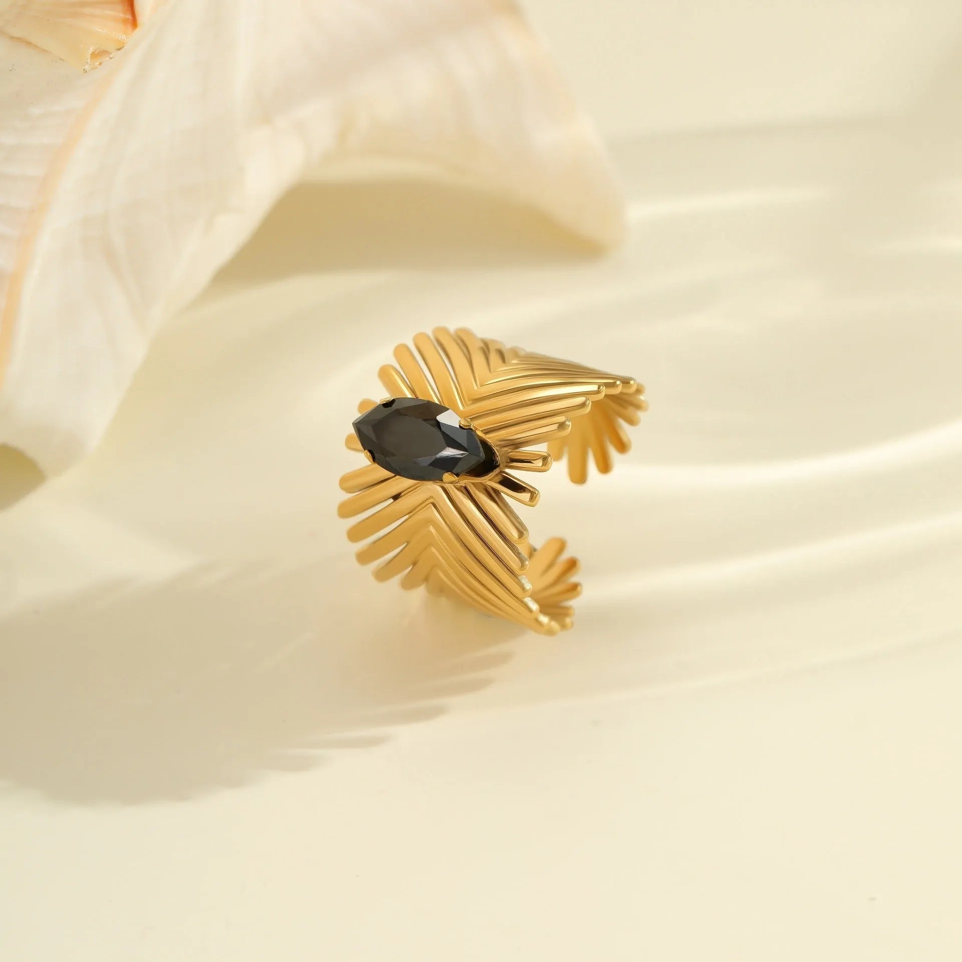 Geometric open mouth women's ring with zircon inlay made from silver-toned electroplated stainless steel.