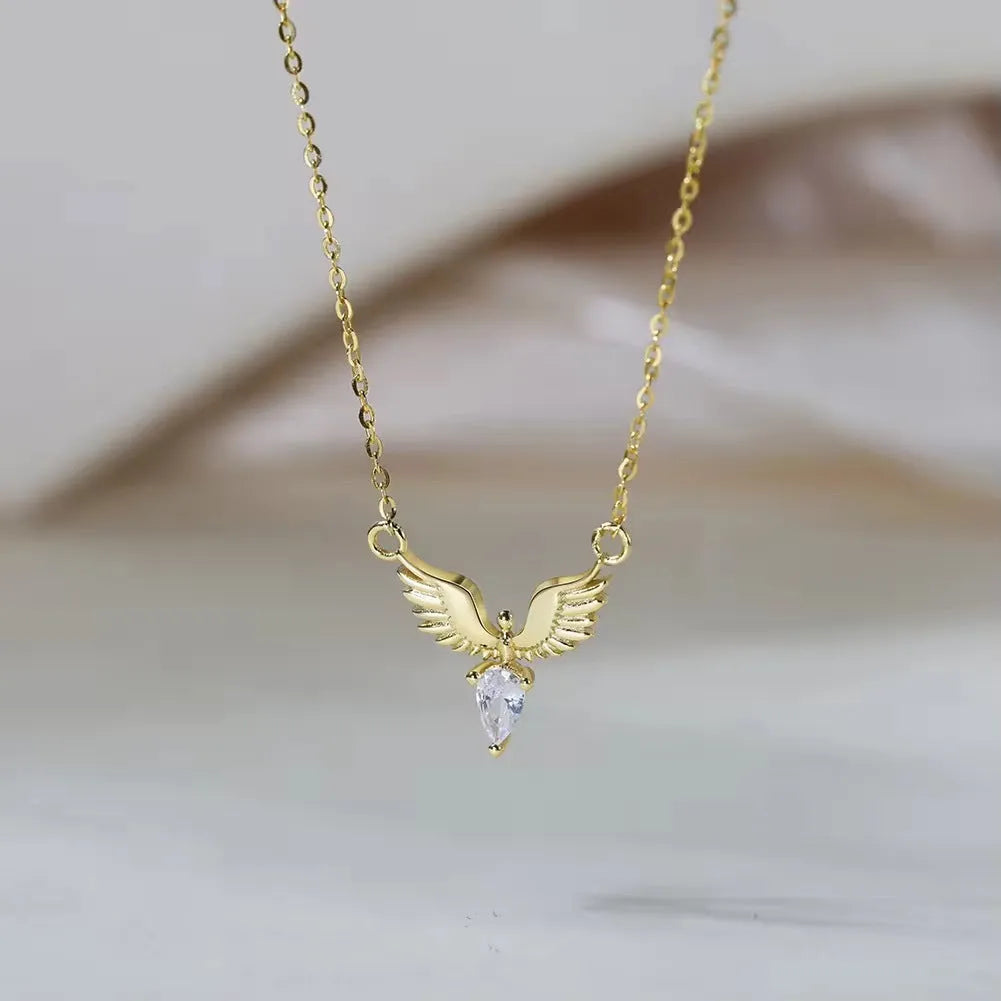 Close-up of an eagle pendant on a silver O-ring chain necklace, showing adjustable length.