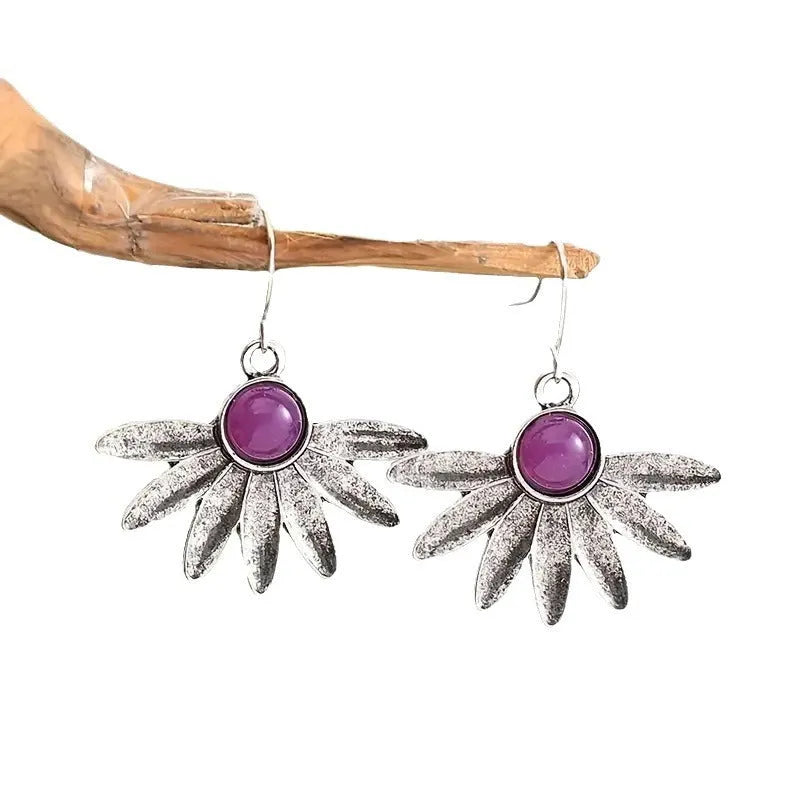 Purple Bohemian drop earrings with resin gemstones and floral animal zodiac designs on alloy settings.