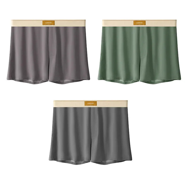 Pack of three men's solid colour loose fit ice silk underwear briefs on a grey background.