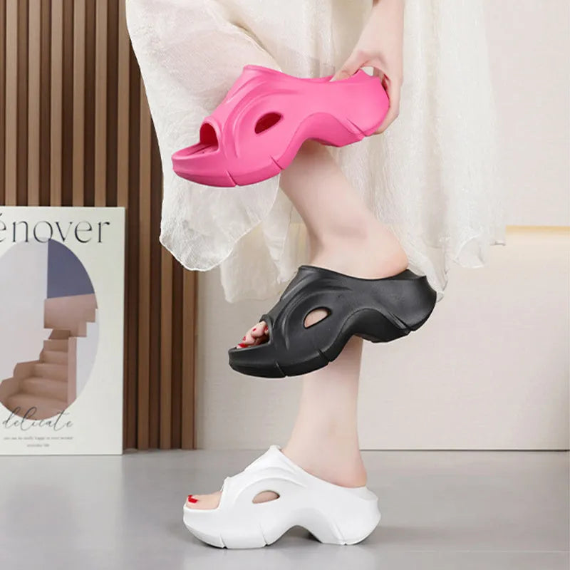 Women's thick-soled beach slippers in white, black, and rose red colours with EVA construction
