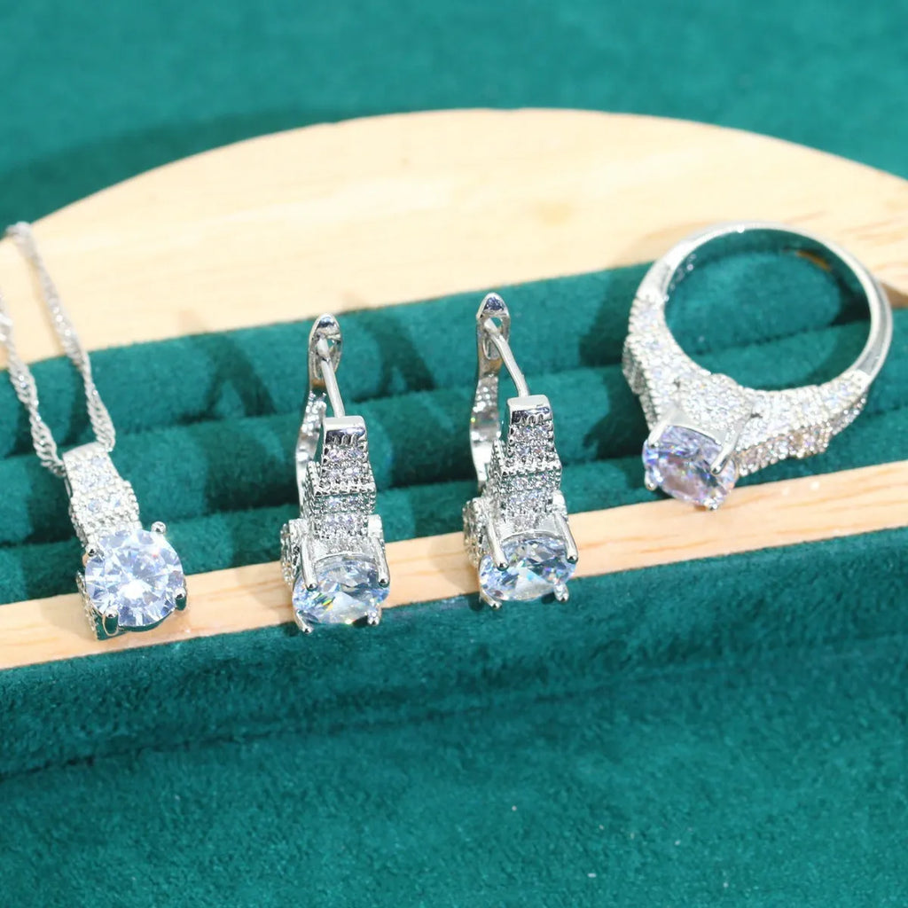 Bridal zircon necklace, earrings, ring, and bracelet four-piece jewellery set in alloy.