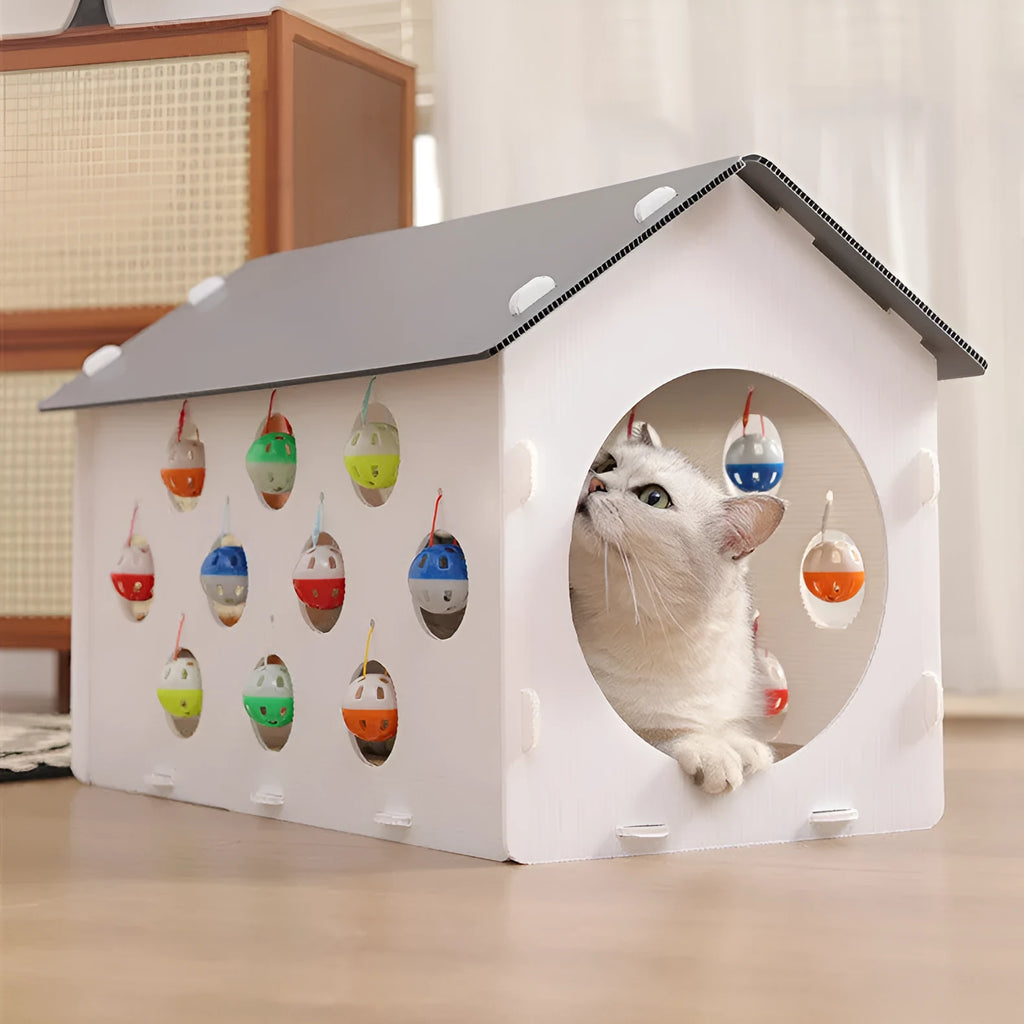 Plastic cat scratch board integrated with cosy nest and tunnel containing bell ball