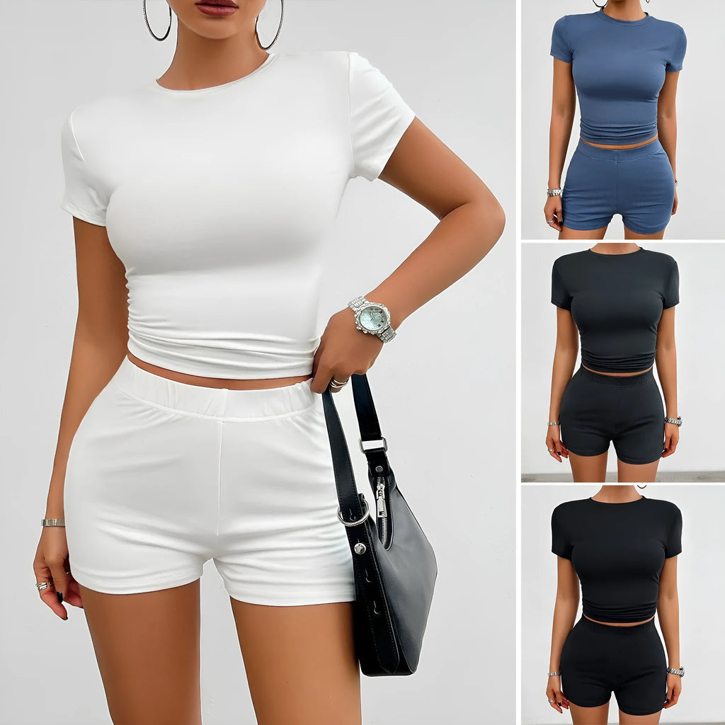 Women's solid colour slim fit sports suit set with short sleeve t-shirt and elastic waist shorts.
