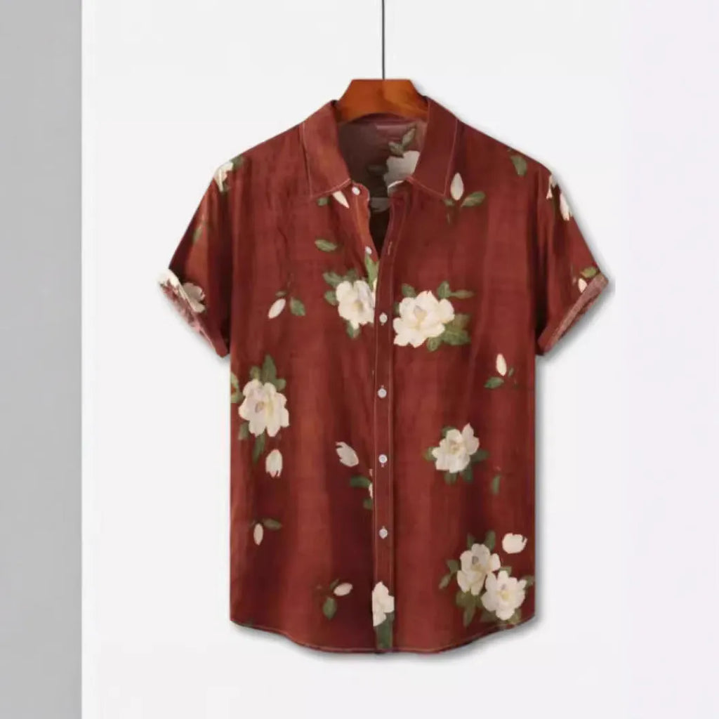 Man wearing a short sleeve Hawaiian floral print shirt with a lapel neckline, showcasing the digital print pattern.