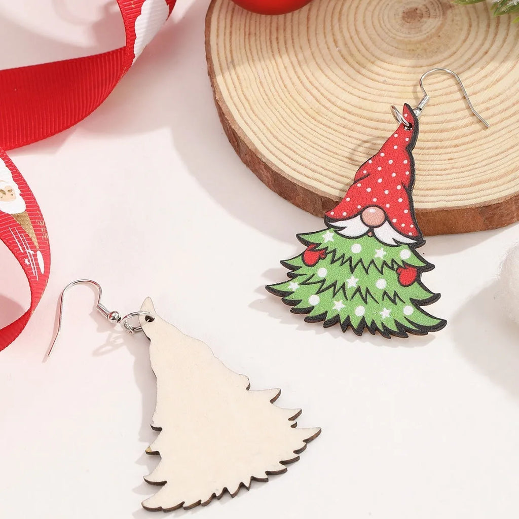 Wooden Christmas earrings with printed tree and snowman designs in geometric shapes