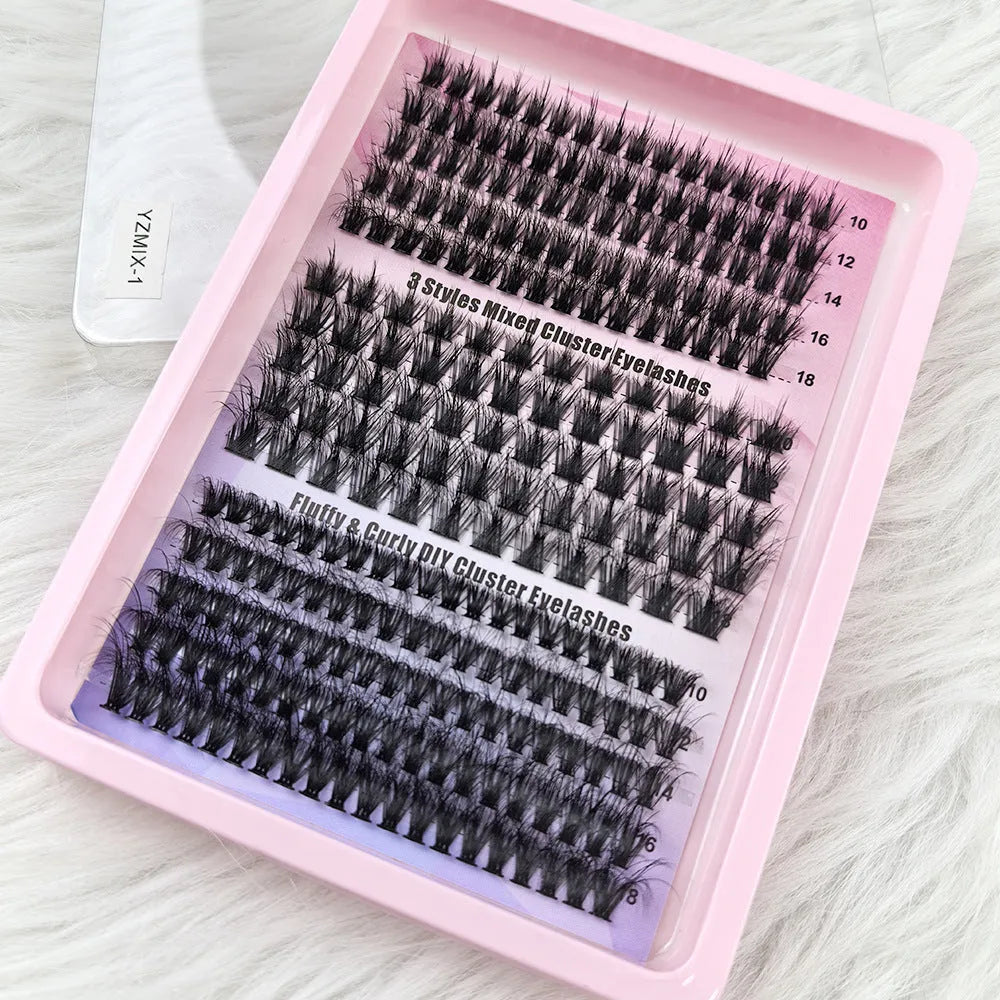 Box of assorted messy style false eyelashes showing multiple lash sets on a clear tray