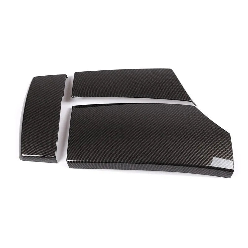 Set of three black ABS protective covers with a carbon fibre weave pattern for car armrest boxes.