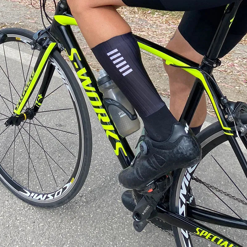 Cycling socks in orange, black, purple, white, grey, or dark blue with moisture-wicking fabric