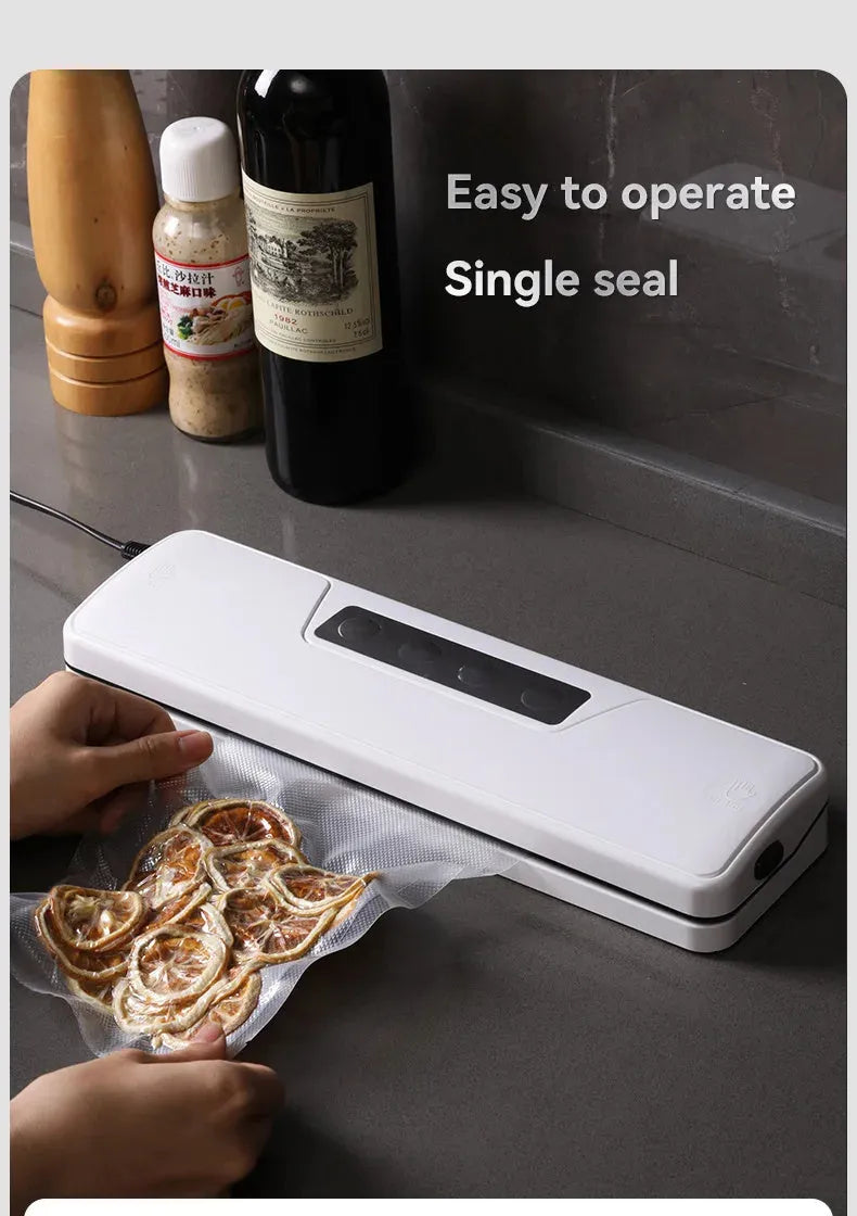 White automatic vacuum sealer machine with compact compression sealing design for household food preservation