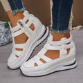 Women's black close-toed platform sandals with Velcro strap and hollow-out design.