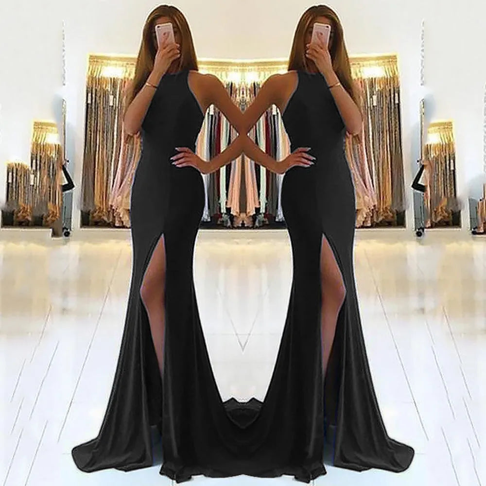 Long red evening dress with a high waist, large swing skirt, hollow detail, and a hanging neckline.