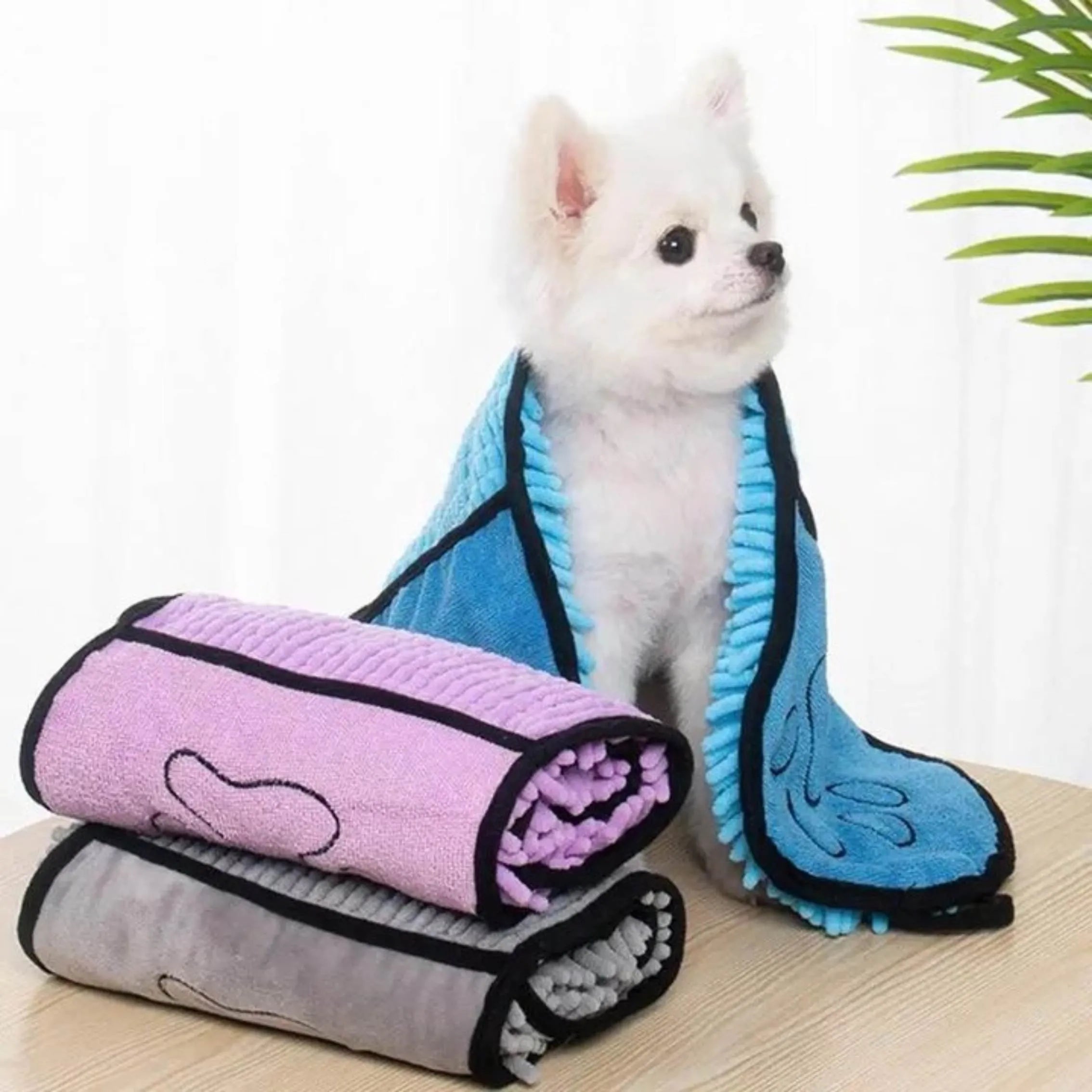 Blue soft fibre pet bath robe towel laid flat, showing its size next to a dog silhouette.