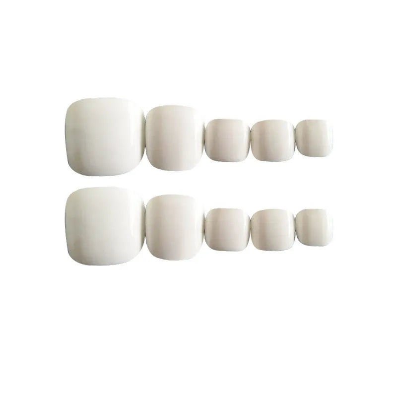 Set of white fake nails with a starry sky pattern, laid out for display.