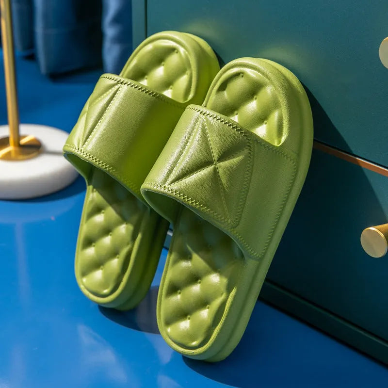 A pair of thick-soled EVA bathroom slippers in a selected colour, showing the non-slip sole pattern.