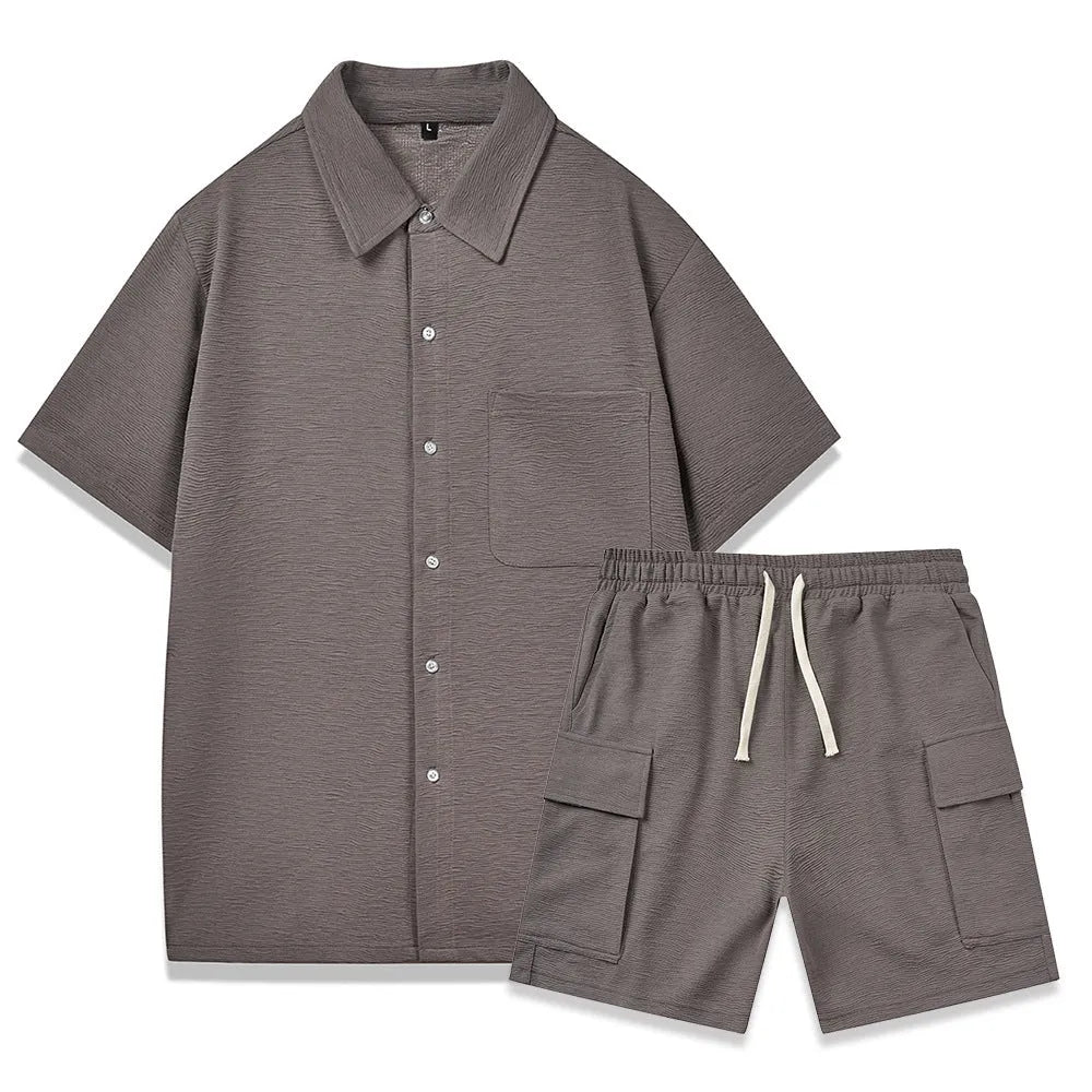 Women's beige elastic waist shorts and short sleeve top two-piece set laid flat.