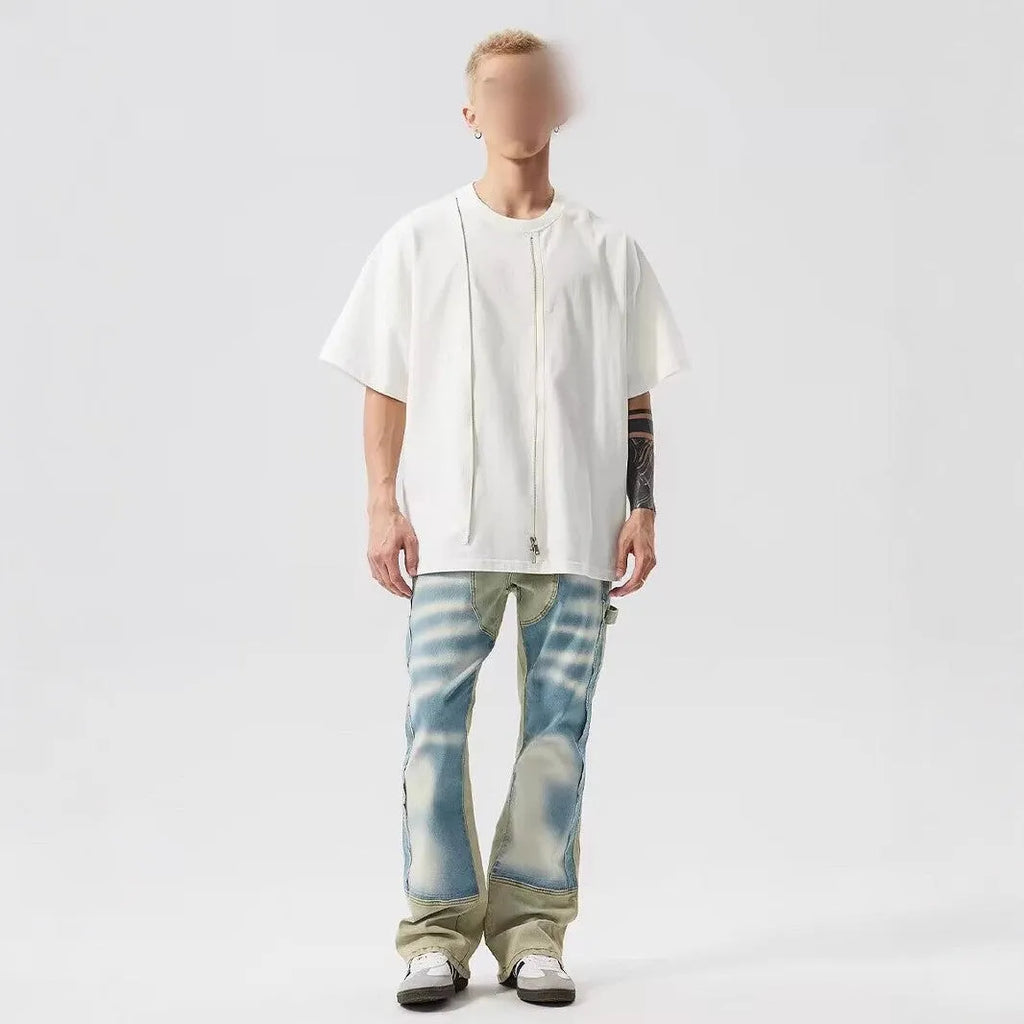 Men's yellow and blue patchwork distressed jeans with splash-ink design detail