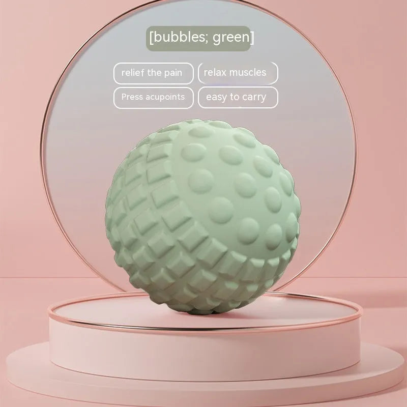 Blue peanut-shaped TPR foot massage ball on a wooden floor.