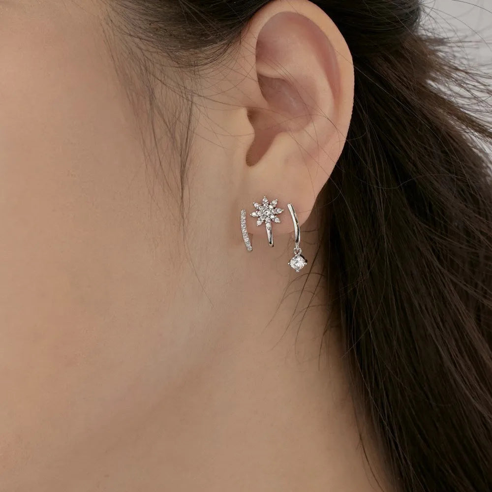 S925 sterling silver snowflake stud earrings in platinum finish with electroplated surface on white background