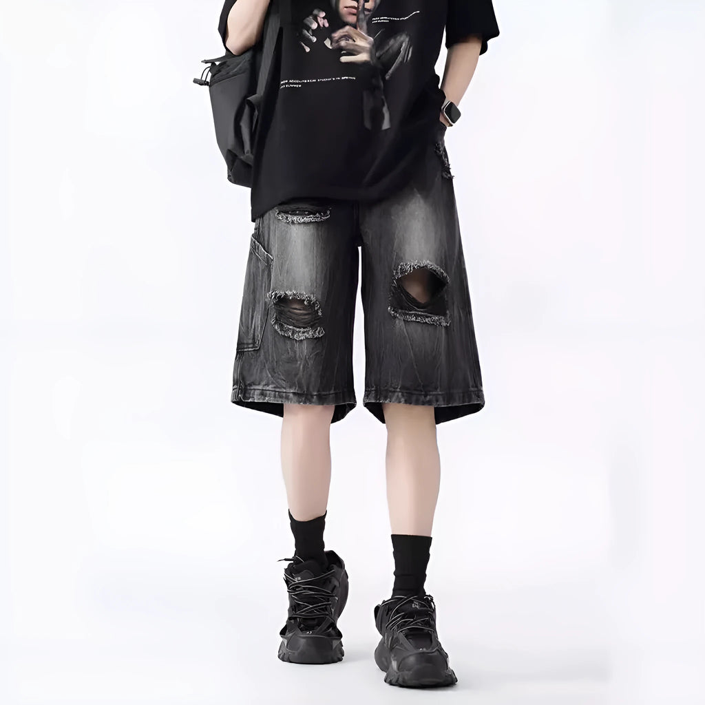 Washed denim shorts with ripped detailing in loose retro fit, black and blue colour options