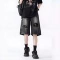 Washed denim shorts with ripped detailing in loose retro fit, black and blue colour options