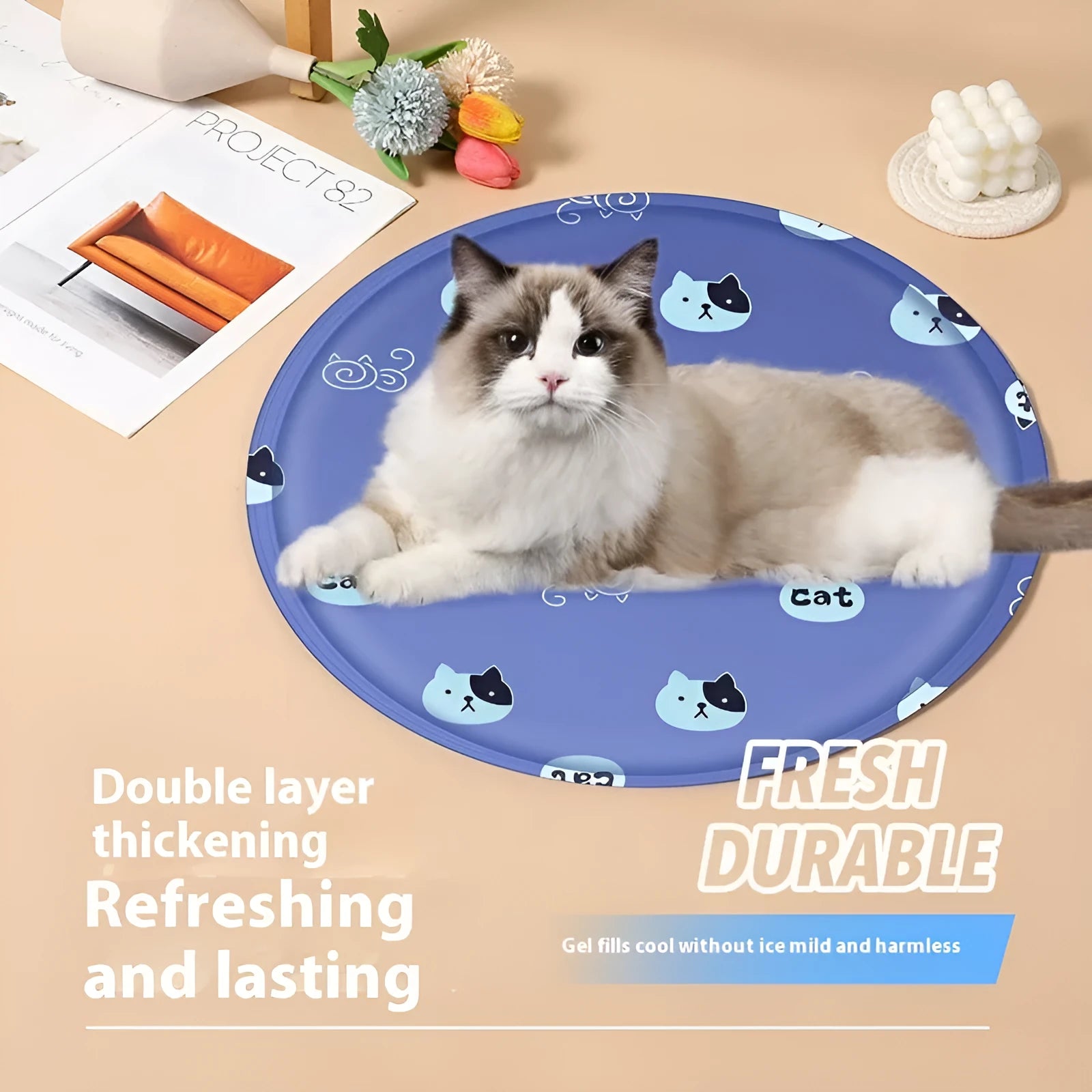 Round cartoon-design pet cooling mat for dogs on a floor, showing beige and blue colour options.