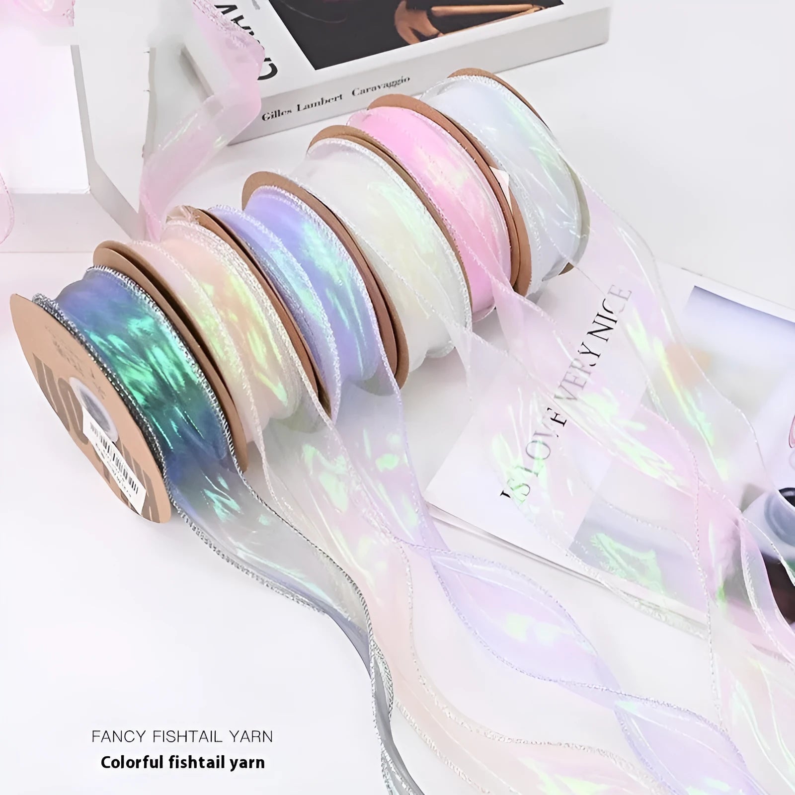 Roll of 4cm wide mesh fishtail yarn floral wave ribbon in multiple illusion colours.